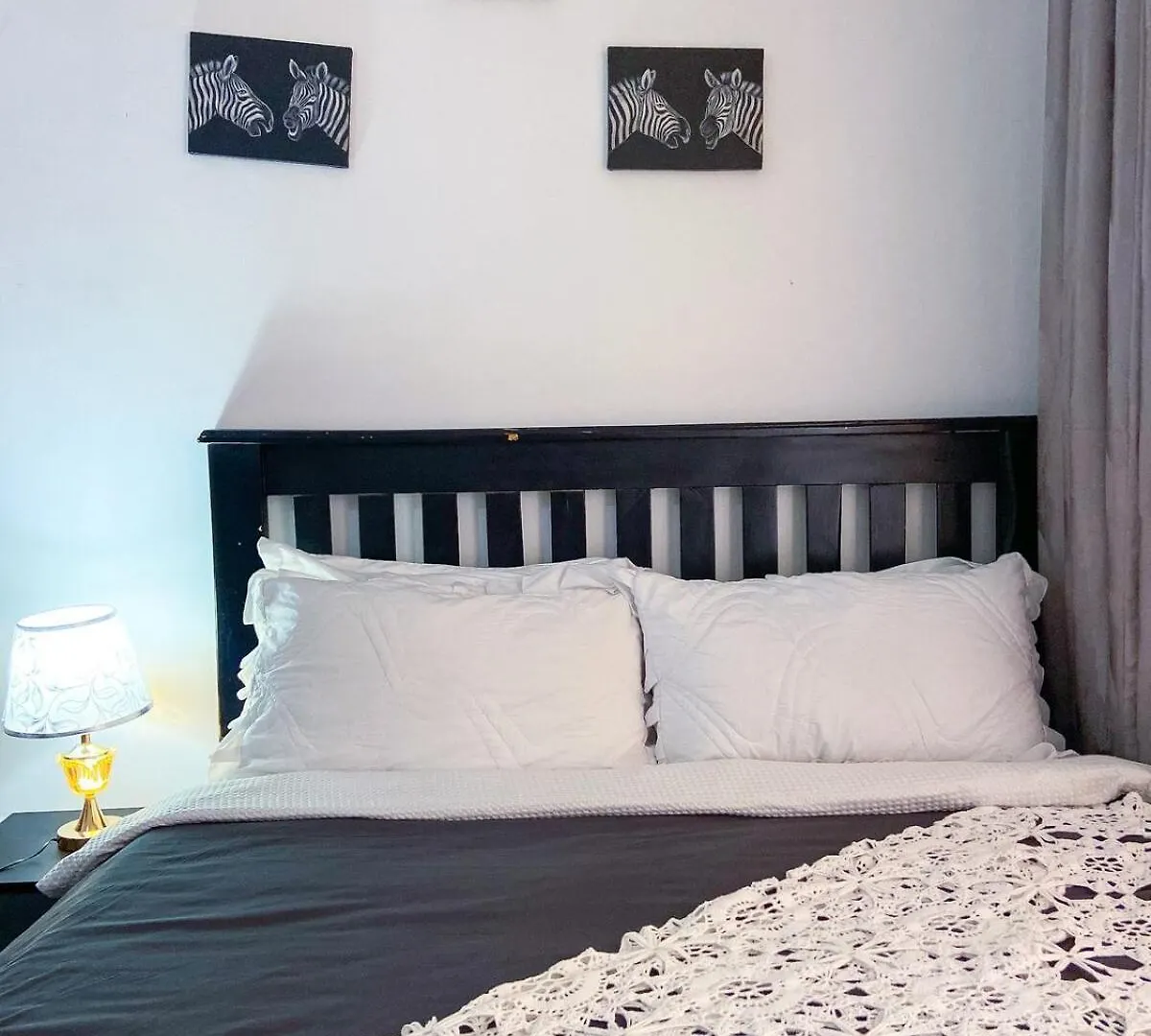 Bedroom In A Serene Environment Entebbe Apartment